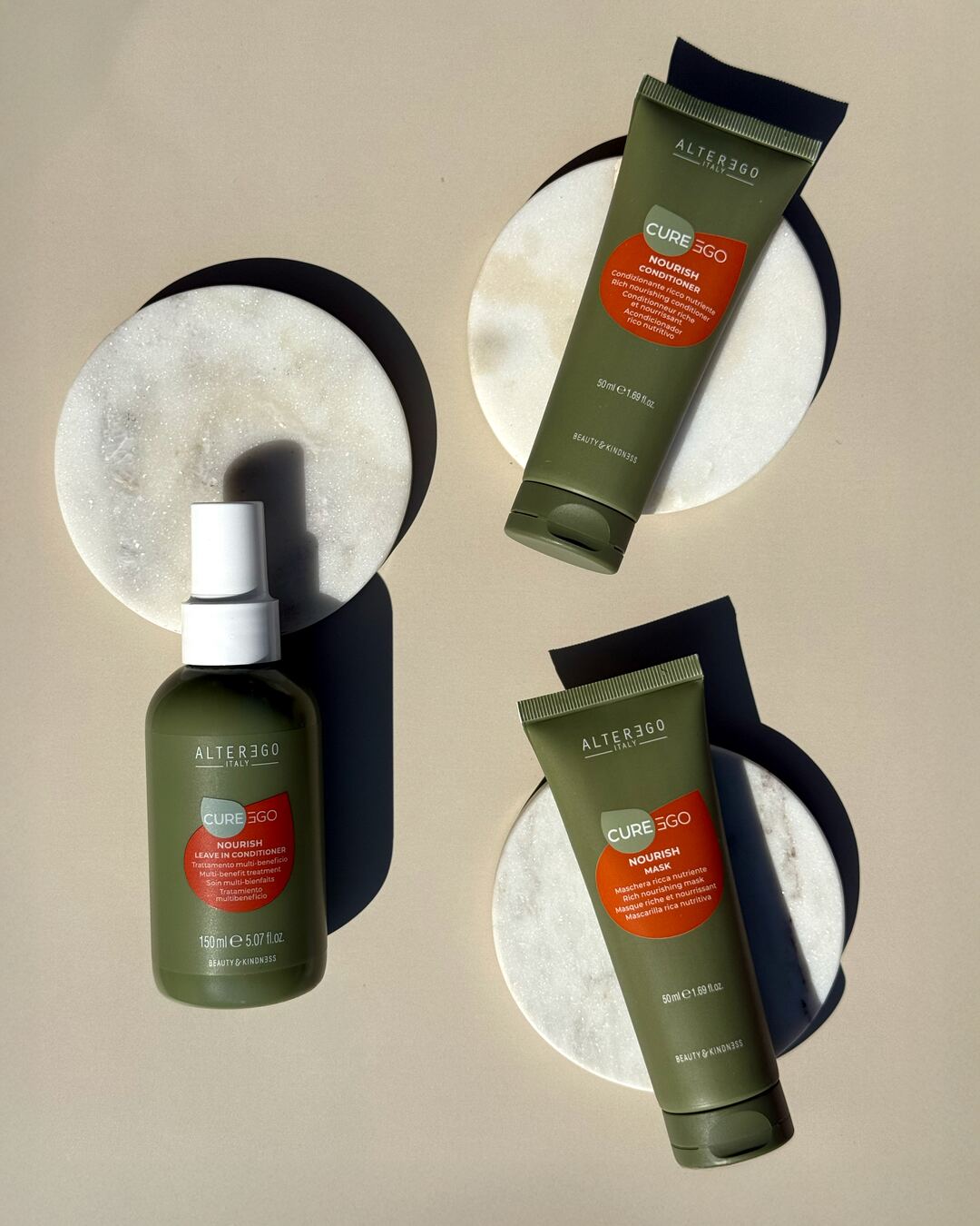 Alter Ego CurEgo Nourish shampoo conditioner and treatment bottles closeup