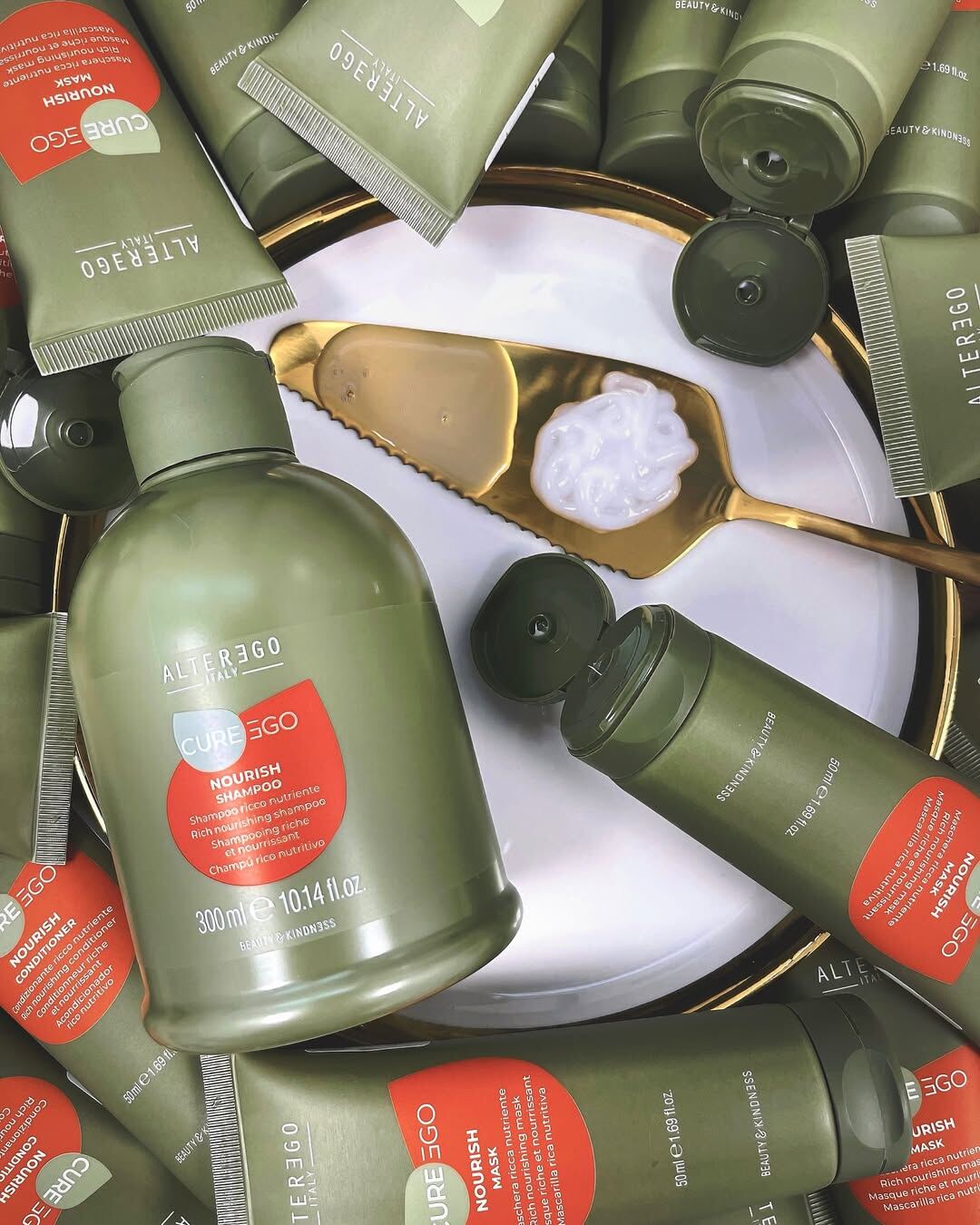 Alter Ego CurEgo Nourish serum and mask flat lay on marble surface
